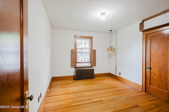 3063 Ny Highway 43, Sand Lake, NY 12018 - unfurnished room with radiator heating unit and light wood-style floors