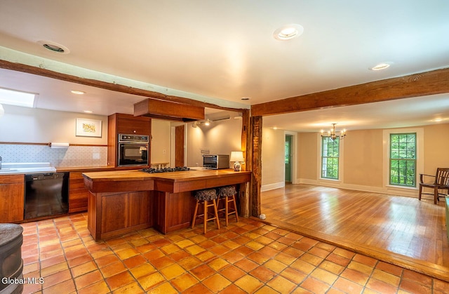 203 Center Rd, White Creek, NY 12057 - kitchen featuring black appliances, wood counters, a chandelier, brown cabinets, and open floor plan
