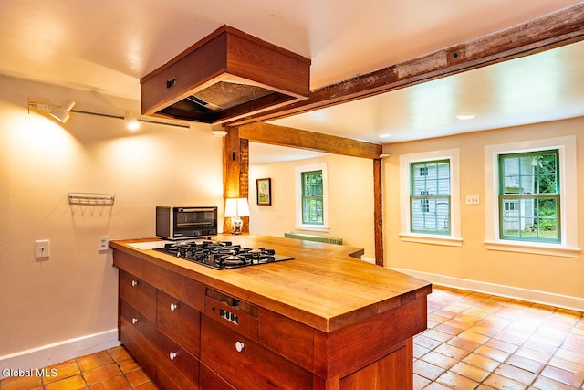 203 Center Rd, White Creek, NY 12057 - kitchen featuring black gas cooktop, butcher block counters, light tile patterned floors, and a peninsula