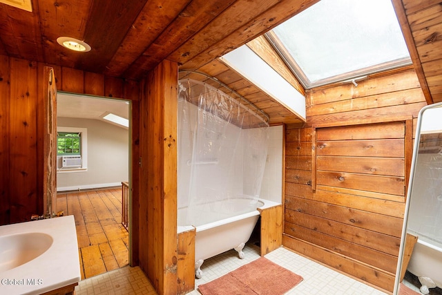 203 Center Rd, White Creek, NY 12057 - bathroom featuring a tub to relax in, a skylight, wood walls, vanity, and cooling unit