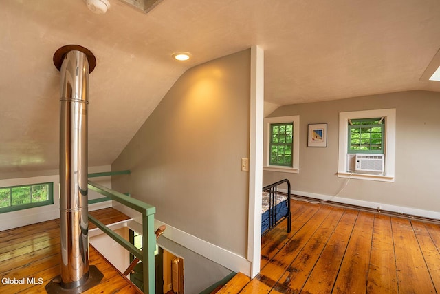 203 Center Rd, White Creek, NY 12057 - stairway featuring lofted ceiling, wood-type flooring, and cooling unit