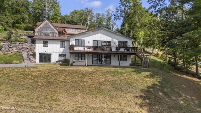 55 Trinity Rock Rd, Lake George, NY 12845 - back of property with stairway, a deck, and a lawn