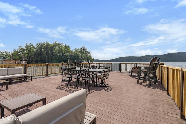 55 Trinity Rock Rd, Lake George, NY 12845 - wooden deck featuring outdoor dining space, a water and mountain view, and outdoor lounge area