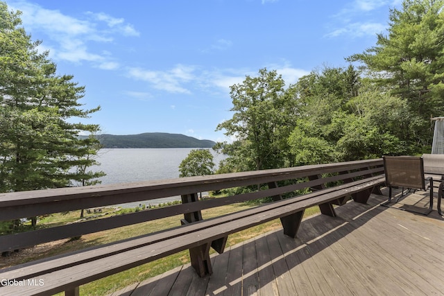 55 Trinity Rock Rd, Lake George, NY 12845 - wooden terrace with a water and mountain view