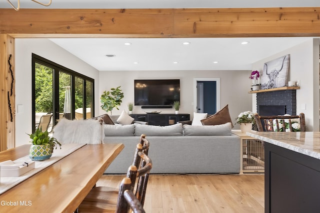 55 Trinity Rock Rd, Lake George, NY 12845 - living room featuring light wood finished floors, a brick fireplace, and recessed lighting