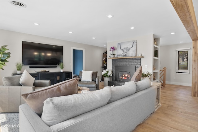 55 Trinity Rock Rd, Lake George, NY 12845 - living area featuring a fireplace, light wood-type flooring, and recessed lighting