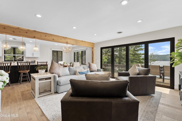 55 Trinity Rock Rd, Lake George, NY 12845 - living room with recessed lighting, healthy amount of natural light, a chandelier, light wood finished floors, and beamed ceiling