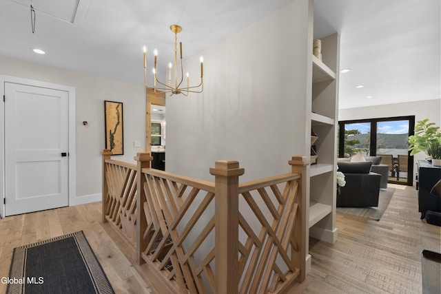 55 Trinity Rock Rd, Lake George, NY 12845 - hall with an upstairs landing, light wood-type flooring, recessed lighting, attic access, and a chandelier