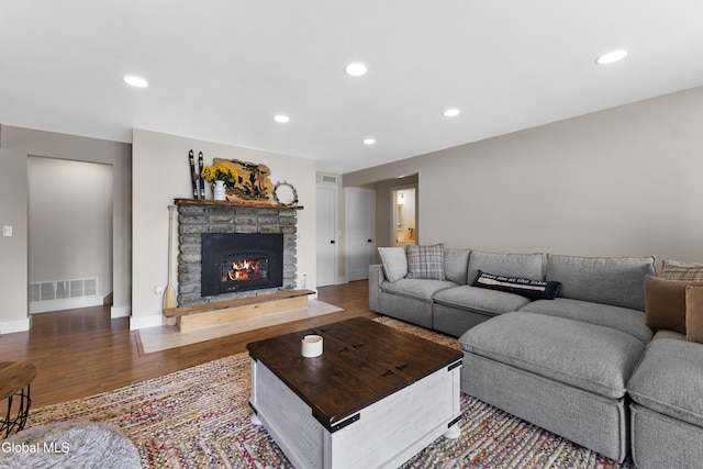 55 Trinity Rock Rd, Lake George, NY 12845 - living room featuring wood finished floors, a fireplace, and recessed lighting