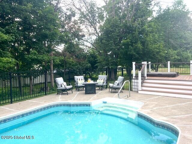 96 Masters Cmn N, Queensbury, NY 12804 - view of pool with a patio area and a deck