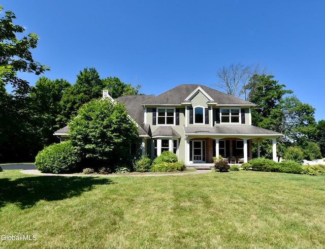 96 Masters Cmn N, Queensbury, NY 12804 - view of front of home featuring a porch and a front yard
