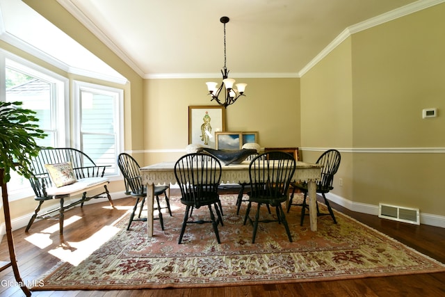 96 Masters Cmn N, Queensbury, NY 12804 - dining space featuring a chandelier, wood finished floors, and crown molding