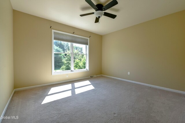 96 Masters Cmn N, Queensbury, NY 12804 - carpeted spare room with baseboards and a ceiling fan