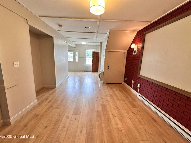 1 S Main St, Voorheesville, NY 12186 - hallway with a baseboard heating unit, brick wall, light wood-type flooring, and radiator
