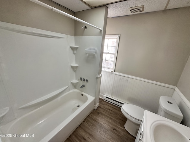 1 S Main St, Voorheesville, NY 12186 - full bathroom with a baseboard radiator, a wainscoted wall, wood finished floors, shower / tub combination, and vanity