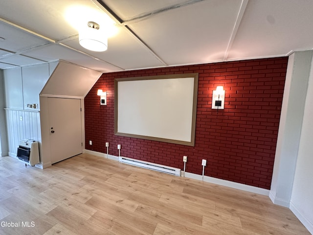 1 S Main St, Voorheesville, NY 12186 - cinema room with brick wall, a baseboard heating unit, light wood finished floors, and heating unit