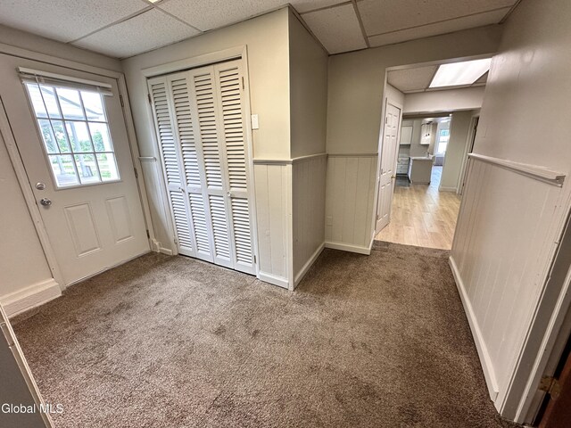 1 S Main St, Voorheesville, NY 12186 - entryway with a wainscoted wall, a drop ceiling, and carpet