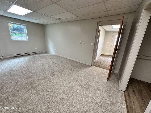 1 S Main St, Voorheesville, NY 12186 - carpeted empty room featuring a baseboard heating unit and a paneled ceiling