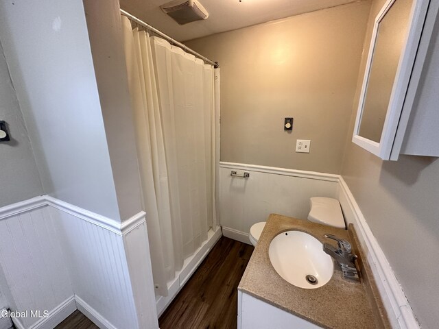 1 S Main St, Voorheesville, NY 12186 - full bath featuring wainscoting, wood finished floors, vanity, and a shower with shower curtain