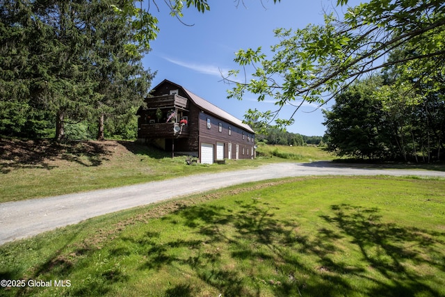 17564 State Route 22, Berlin, NY 12022 - view of home's exterior with driveway, a lawn, an attached garage, a wooden deck, and a metal roof