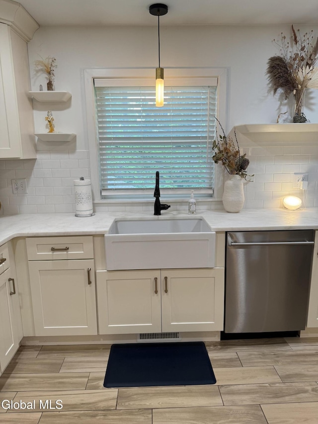 32 Winnie St, Albany, NY 12208 - kitchen with stainless steel dishwasher, open shelves, wood finish floors, tasteful backsplash, and pendant lighting