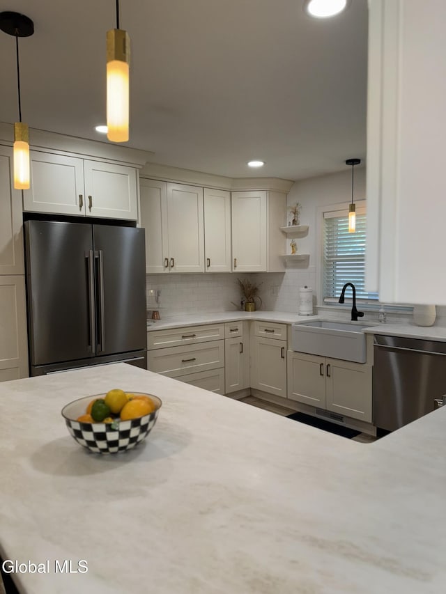 32 Winnie St, Albany, NY 12208 - kitchen with appliances with stainless steel finishes, light countertops, decorative light fixtures, open shelves, and decorative backsplash