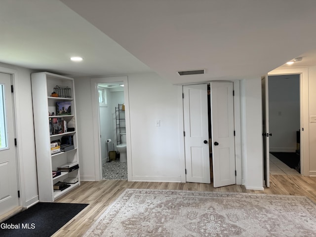 32 Winnie St, Albany, NY 12208 - unfurnished bedroom with wood finished floors, ensuite bathroom, and a closet