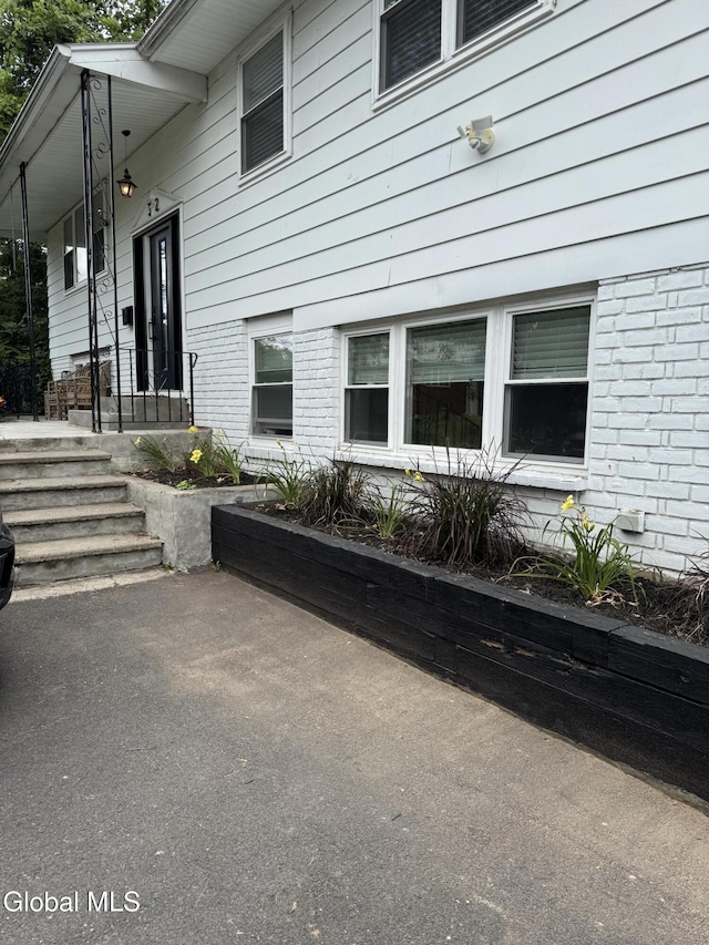 32 Winnie St, Albany, NY 12208 - property entrance featuring brick siding