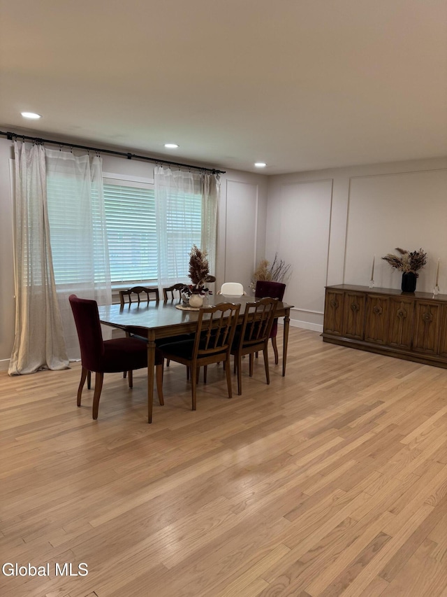 32 Winnie St, Albany, NY 12208 - dining space with light wood-style floors, recessed lighting, and a decorative wall