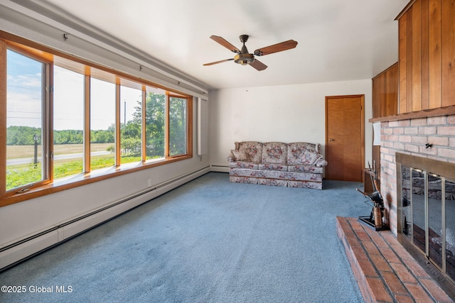 921 Altamont Voorheesville Rd, Altamont, NY 12009 - living area featuring a baseboard heating unit, a fireplace, a ceiling fan, and carpet flooring