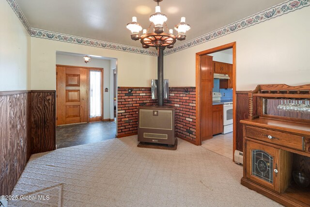921 Altamont Voorheesville Rd, Altamont, NY 12009 - living area with wainscoting, a chandelier, and a baseboard radiator