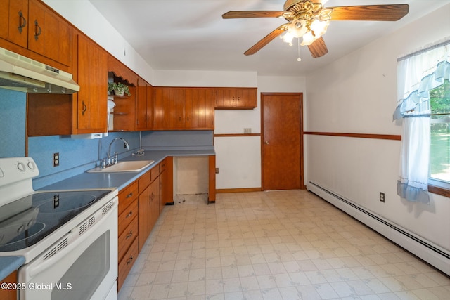 921 Altamont Voorheesville Rd, Altamont, NY 12009 - kitchen featuring white electric range oven, under cabinet range hood, a baseboard radiator, and brown cabinetry