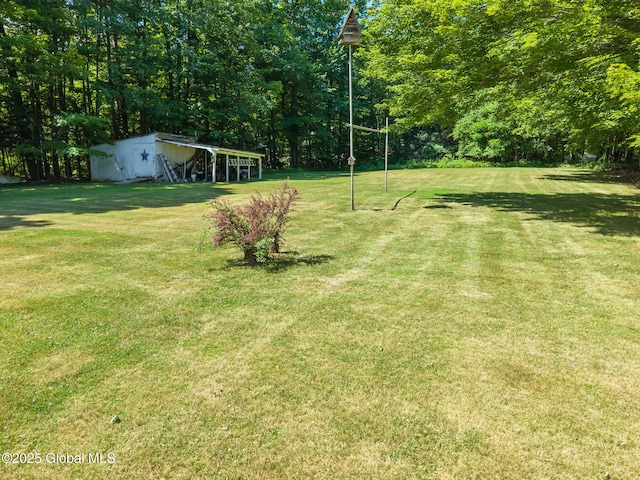 921 Altamont Voorheesville Rd, Altamont, NY 12009 - view of grassy yard with an outbuilding