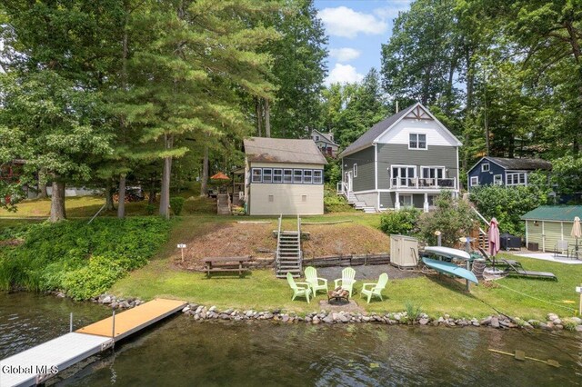 2235 Oaks Rd, Argyle, NY 12809 - rear view of house featuring stairs, an outdoor fire pit, and a yard