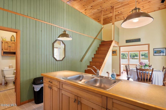 2235 Oaks Rd, Argyle, NY 12809 - kitchen featuring a towering ceiling, pendant lighting, wooden ceiling, and light countertops