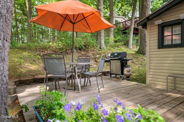 2235 Oaks Rd, Argyle, NY 12809 - wooden terrace with outdoor dining area and a grill