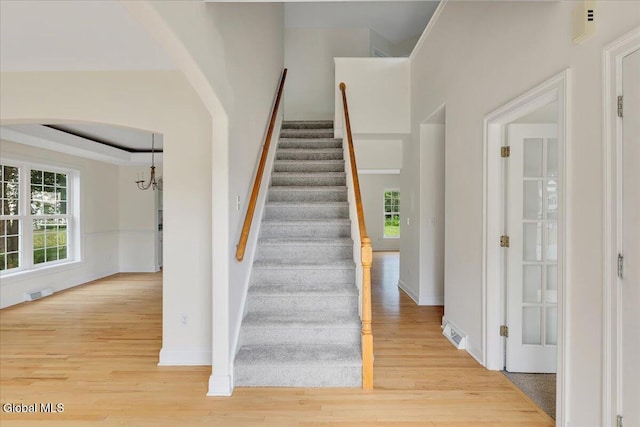 3 Lucille Ln, Malta, NY 12019 - stairs featuring wood finished floors and a chandelier