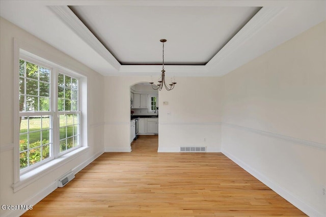 3 Lucille Ln, Malta, NY 12019 - unfurnished dining area featuring a chandelier, healthy amount of natural light, and light wood-style flooring