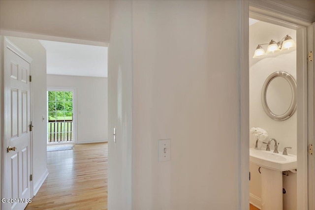 3 Lucille Ln, Malta, NY 12019 - hallway with light wood-type flooring and baseboards