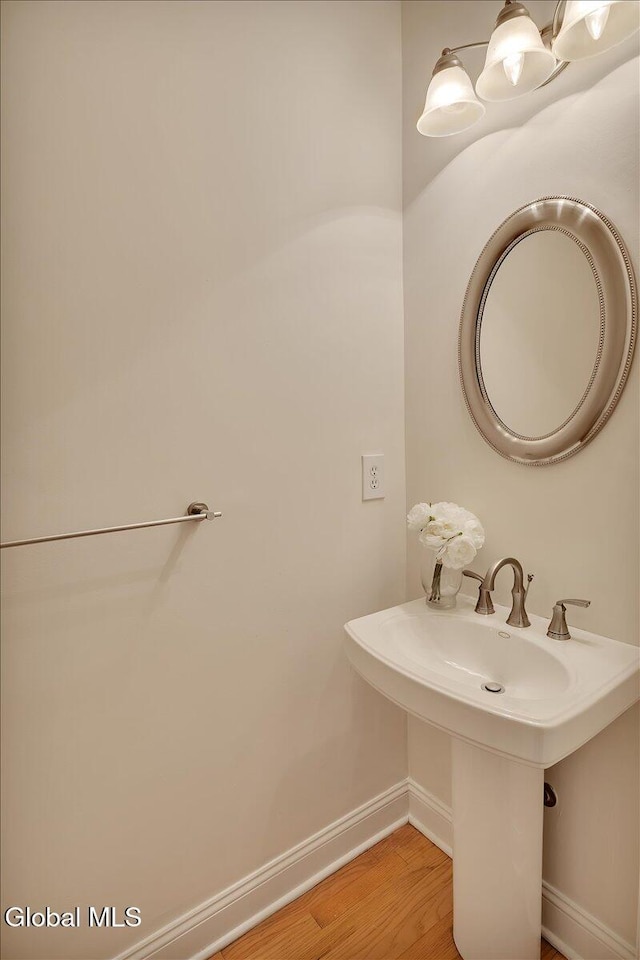 3 Lucille Ln, Malta, NY 12019 - bathroom featuring baseboards and wood finished floors
