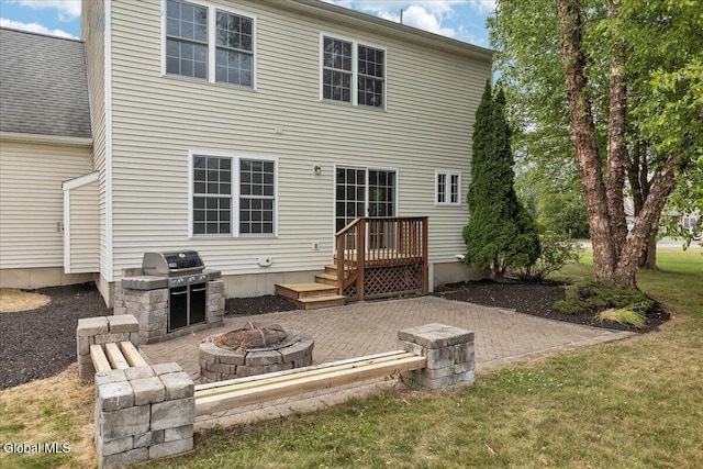 3 Lucille Ln, Malta, NY 12019 - back of property with an outdoor fire pit, a patio, and a yard