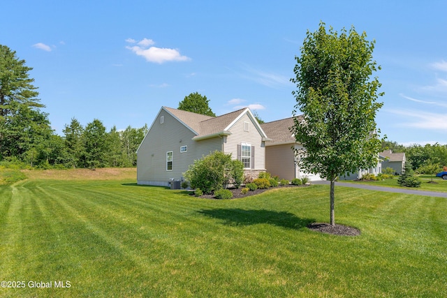 55 Winterberry Ln, Moreau, NY 12828 - view of home's exterior featuring a lawn and stone siding
