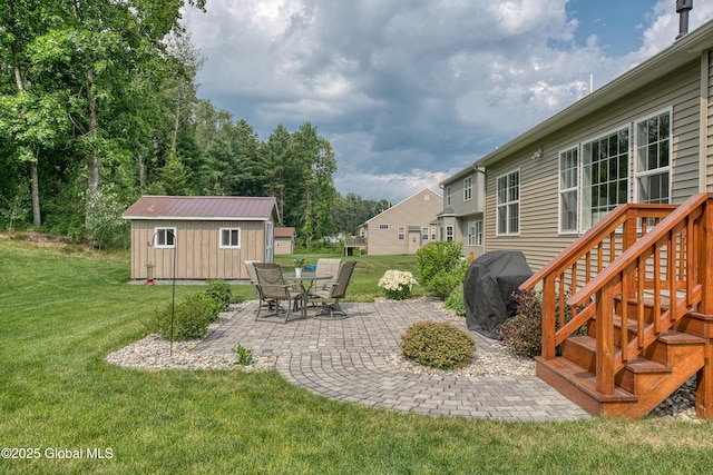 55 Winterberry Ln, Moreau, NY 12828 - view of green lawn with a patio area and an outbuilding