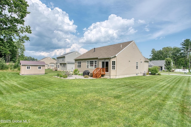 55 Winterberry Ln, Moreau, NY 12828 - back of property featuring a lawn, a shed, and a shingled roof