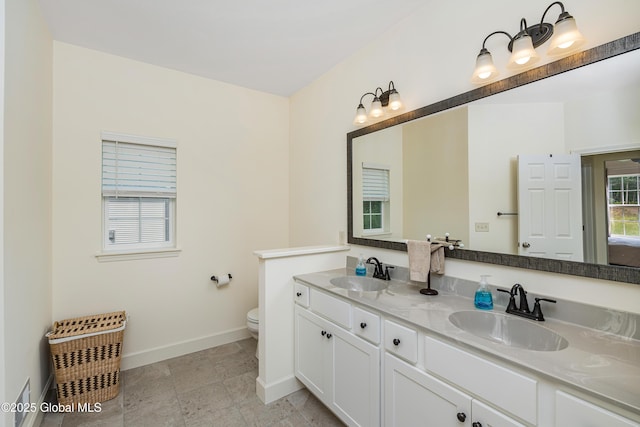 55 Winterberry Ln, Moreau, NY 12828 - full bath featuring baseboards and double vanity