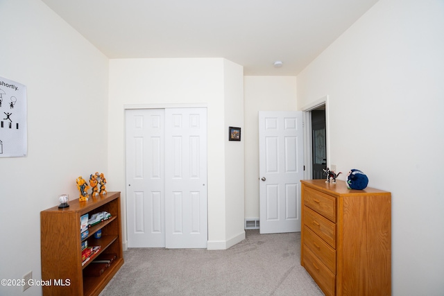 55 Winterberry Ln, Moreau, NY 12828 - bedroom with light colored carpet and a closet