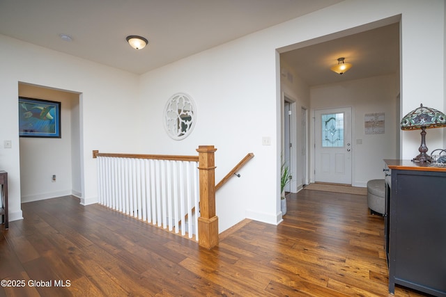 55 Winterberry Ln, Moreau, NY 12828 - corridor with dark wood finished floors and an upstairs landing