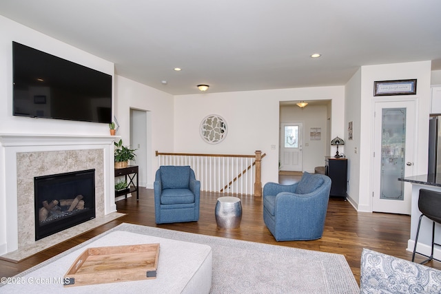 55 Winterberry Ln, Moreau, NY 12828 - living area featuring dark wood-style floors, recessed lighting, and a premium fireplace