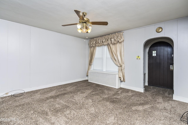 1633 Chrisler Ave, Schenectady, NY 12303 - carpeted empty room featuring arched walkways, a ceiling fan, and healthy amount of natural light