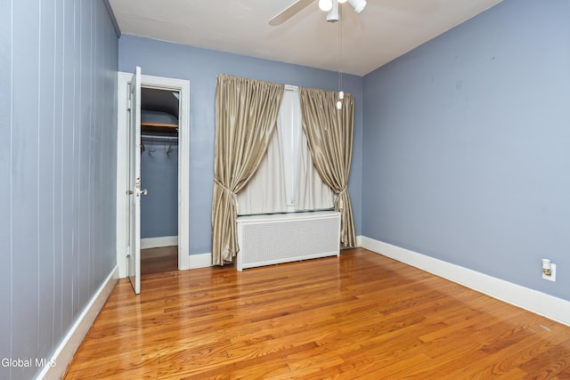 1633 Chrisler Ave, Schenectady, NY 12303 - spare room with radiator, a ceiling fan, and wood finished floors
